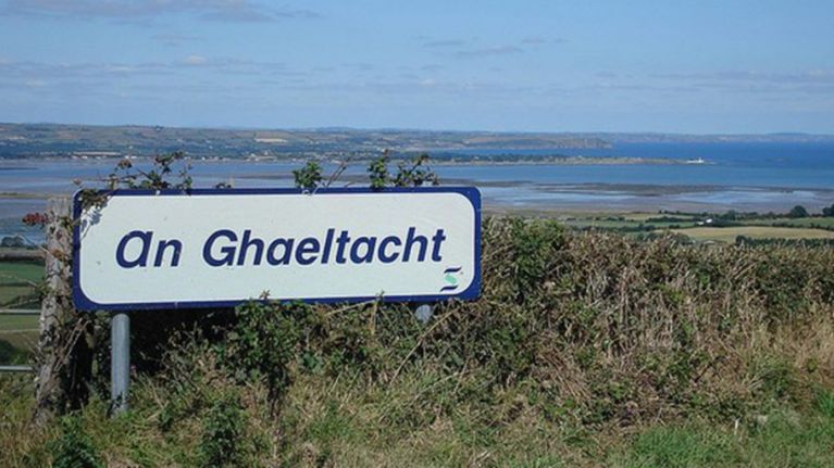 Sign for An Gaeltacht in a rural setting, publicisng Fórsa Gaeltacht grants.